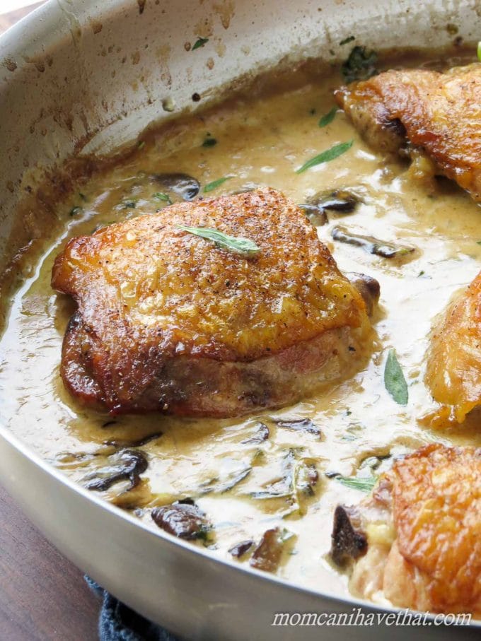 Chicken Thighs with Mushrooms and Tarragon Cream features golden chicken thighs in a white wine and cream sauce flavored with shallots and fresh tarragon. 7 net carbs per serving.