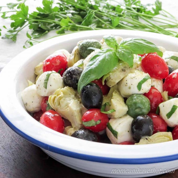 Caprese Salad with Olives & Marinated Artichoke Hearts is great for gatherings. | low carb, gluten-free, keto |lowcarbmaven.com