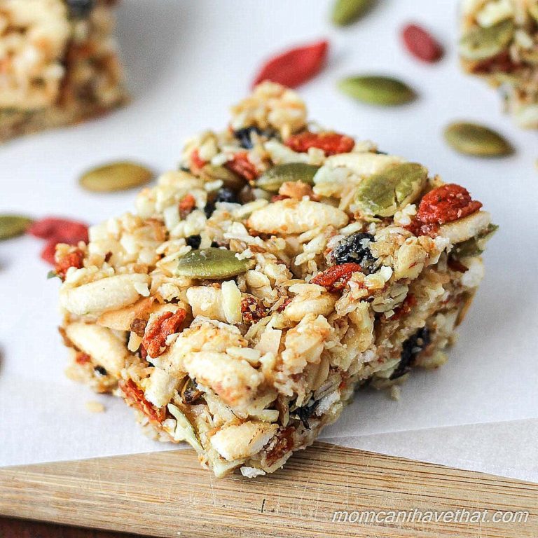 Gluten-free oats, nuts, & seeds make the base for these lightly - sweetened Kitchen Sink Snack Bars healthy - currents, puffed rice & gogi berries make them fun.| gluten-free, dairy-free | MomCanIHaveThat.com