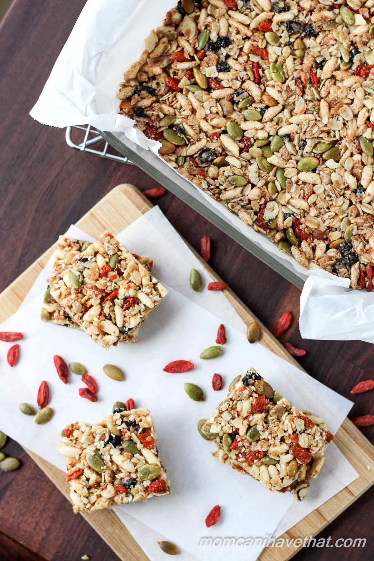 Gluten-free oats, nuts, & seeds make the base for these lightly - sweetened Kitchen Sink Snack Bars healthy - currents, puffed rice & gogi berries make them fun.| gluten-free, dairy-free | MomCanIHaveThat.com