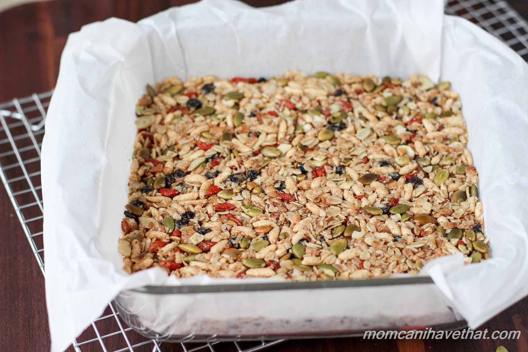 Gluten-free oats, nuts, & seeds make the base for these lightly - sweetened Kitchen Sink Snack Bars healthy - currents, puffed rice & gogi berries make them fun.| gluten-free, dairy-free | MomCanIHaveThat.com