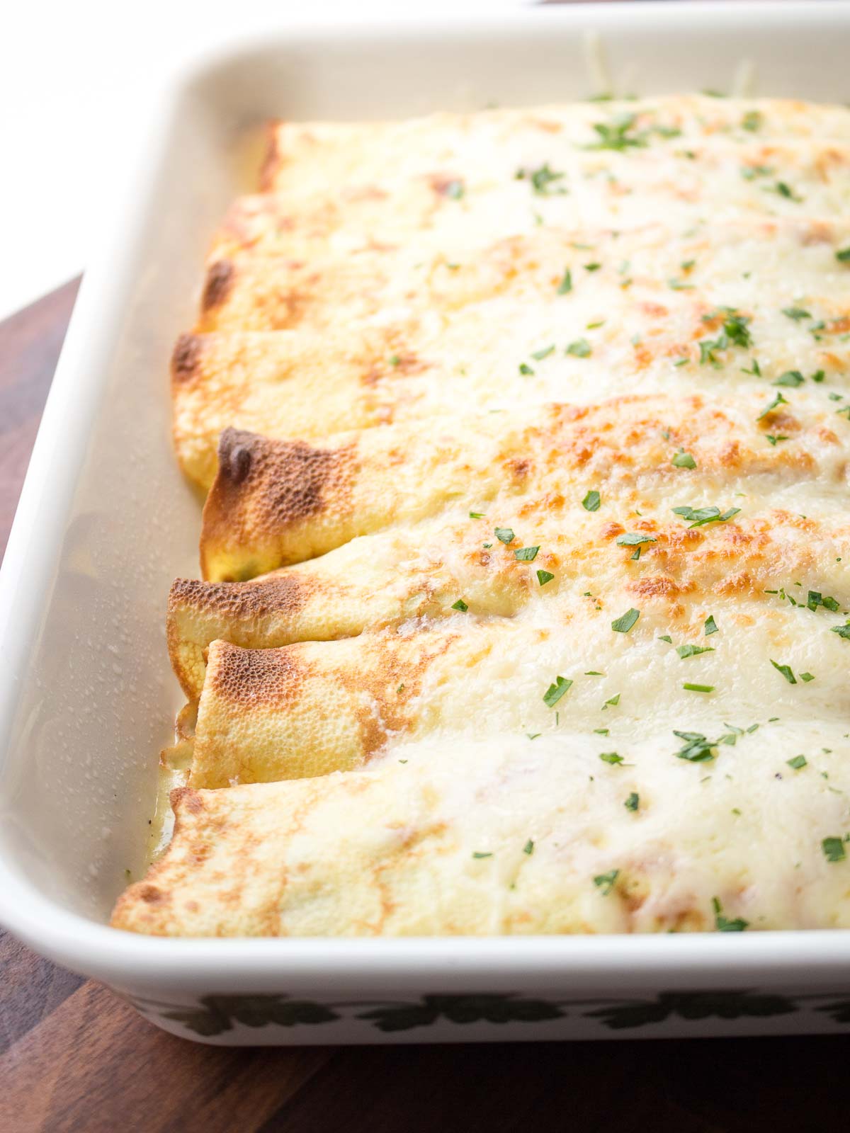 Chicken Florentine Crepes baked in a pan.