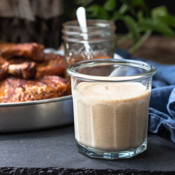 Alabama white BBQ sauce with smoked chicken quarters.