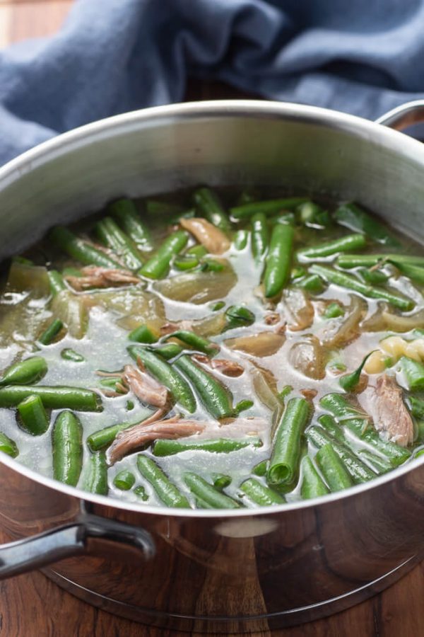 Southern green beans with pork and pot liquor in a pot.