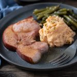 Ham steak with red eye gravy, cheesy cauliflower mash and green beans.