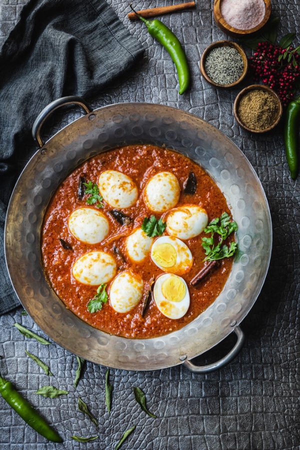 Egg masala (Indian egg curry) in a wok with cilantro.