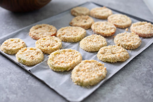 Sliced green tomatoes with keto breading before frying