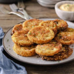 Crispy keto fried green tomatoes on a plate
