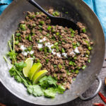Keto green bean beef keema with yogurt, cilantro and limes in a wok