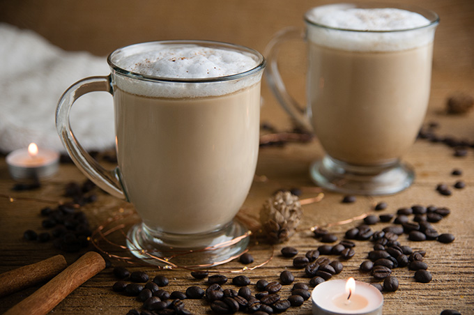Low Carb Russian Coffee on wood with coffee beans, cinnamon sticks, and fuzzy white blanket