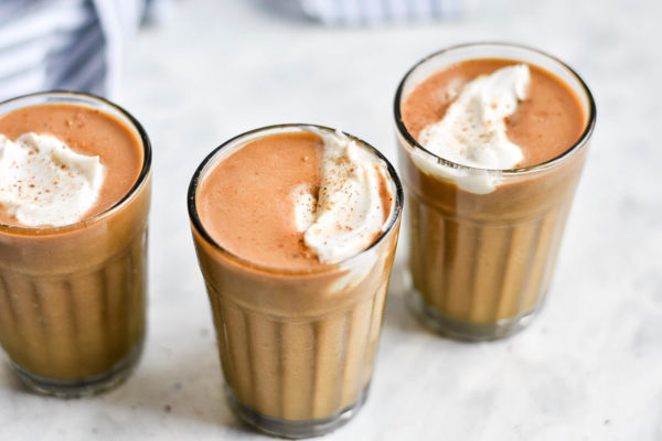 three pumpkin spice latte milkshakes in glasses
